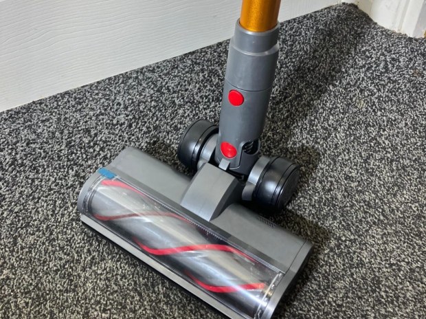Cordless vacuum cleaner on carpet.