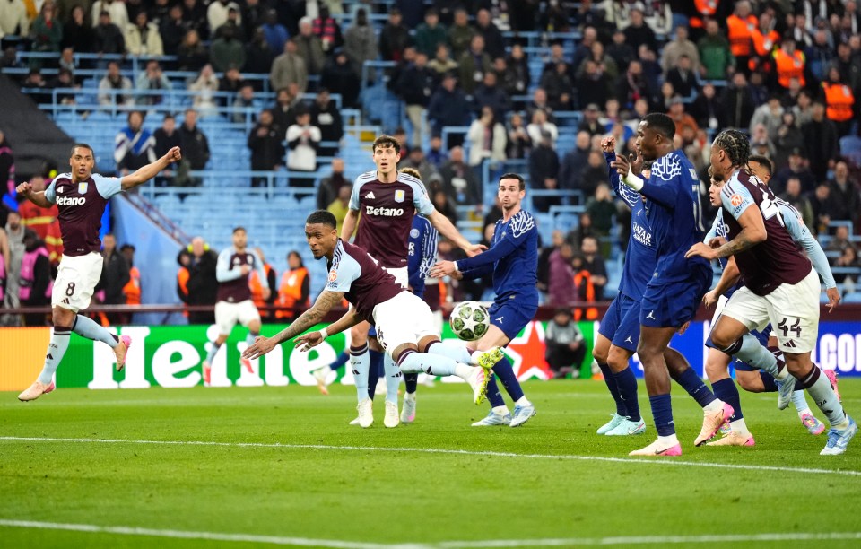 Aston Villa player attempting a headed shot on goal.