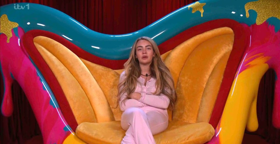 Ella Rae Wise sitting in a brightly colored chair during a nomination.