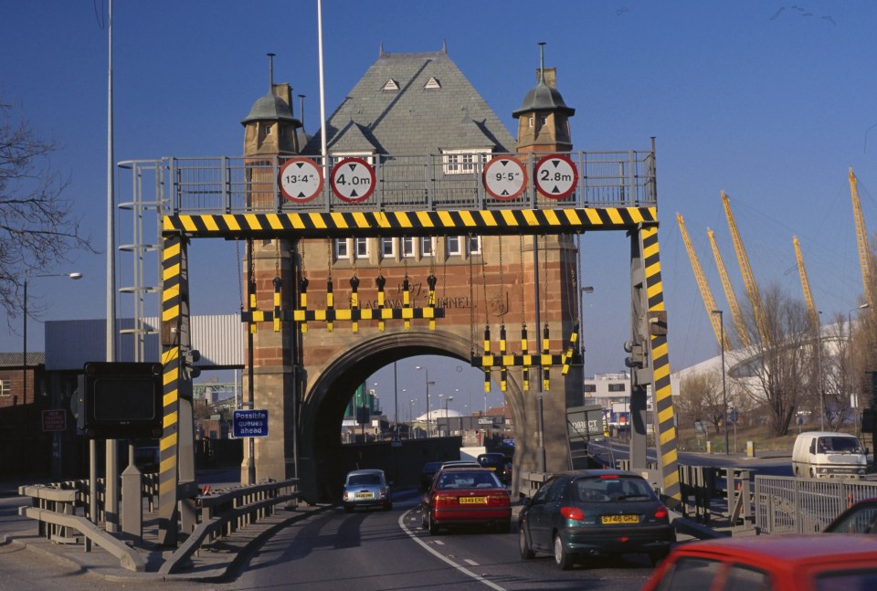 Entrance to the Blackwall Tunnel with height restriction signs.