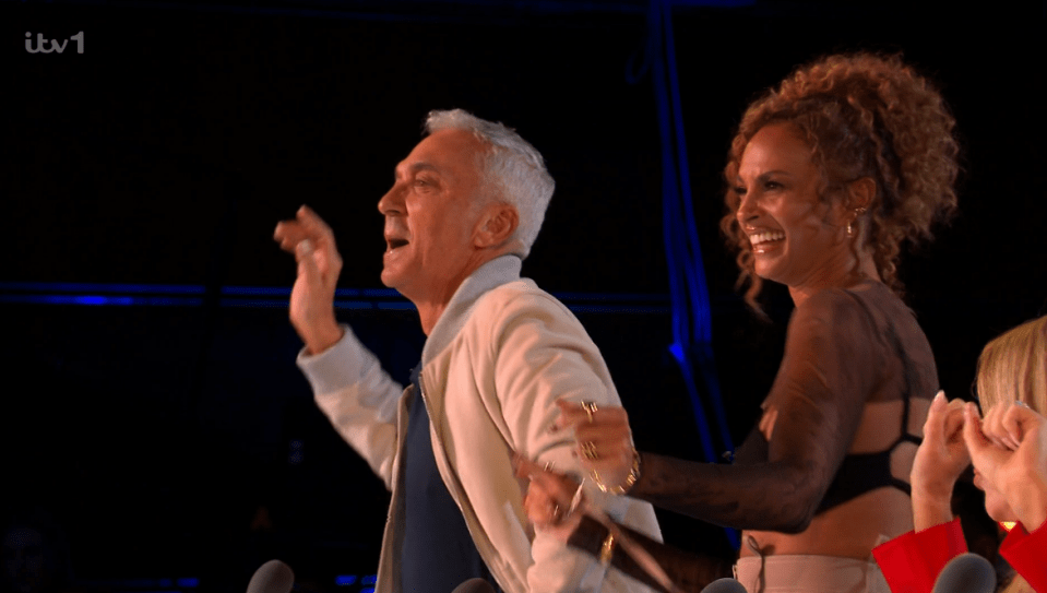 Two excited judges reacting on a TV show.