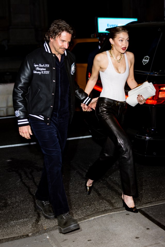 Bradley Cooper and Gigi Hadid walking hand-in-hand.