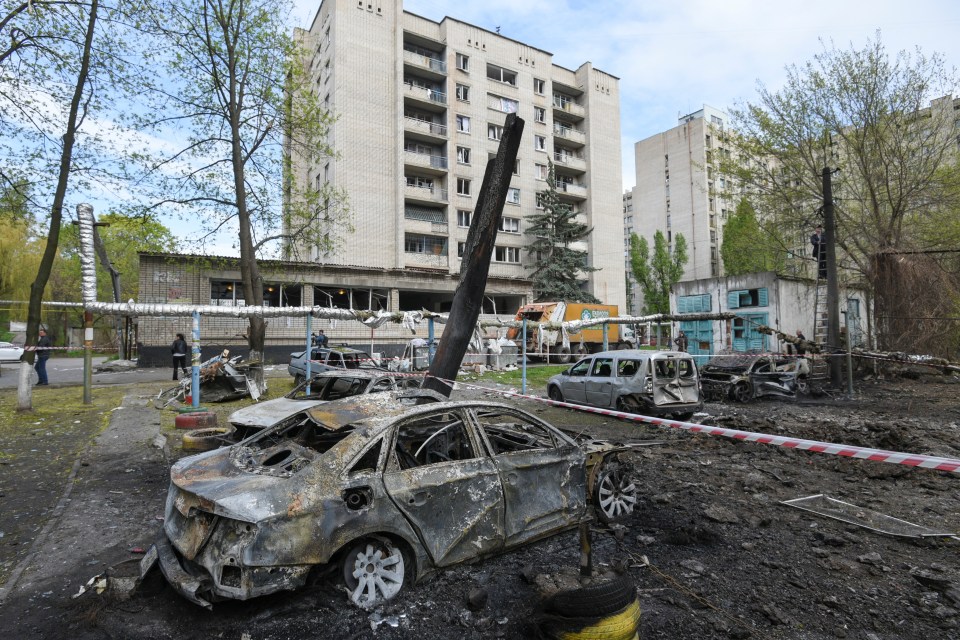 Burned cars at the site of a Russian drone strike in Dnipro, Ukraine.