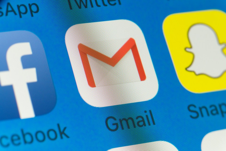 Close-up of smartphone screen displaying Gmail, Facebook, Snapchat, and WhatsApp app icons.