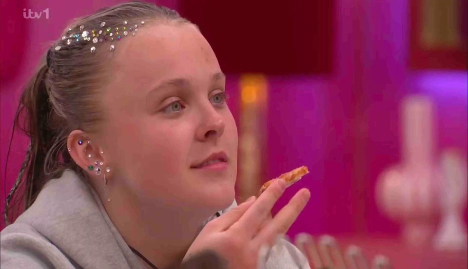 JoJo Siwa eating pizza on Celebrity Big Brother.