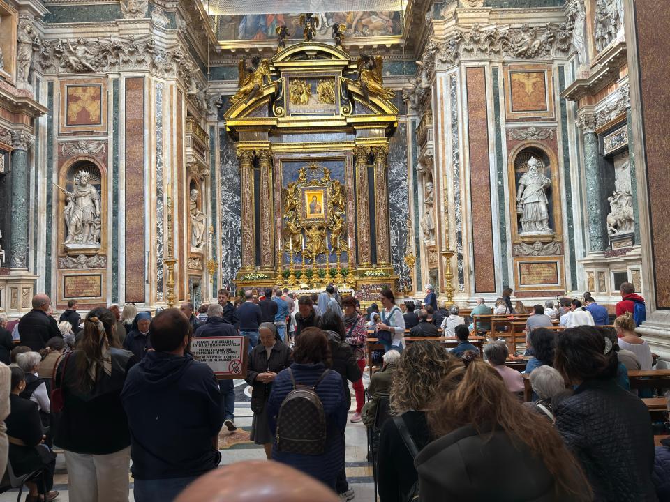 Catholics praying in the Basilica di Santa Maria Maggiore.