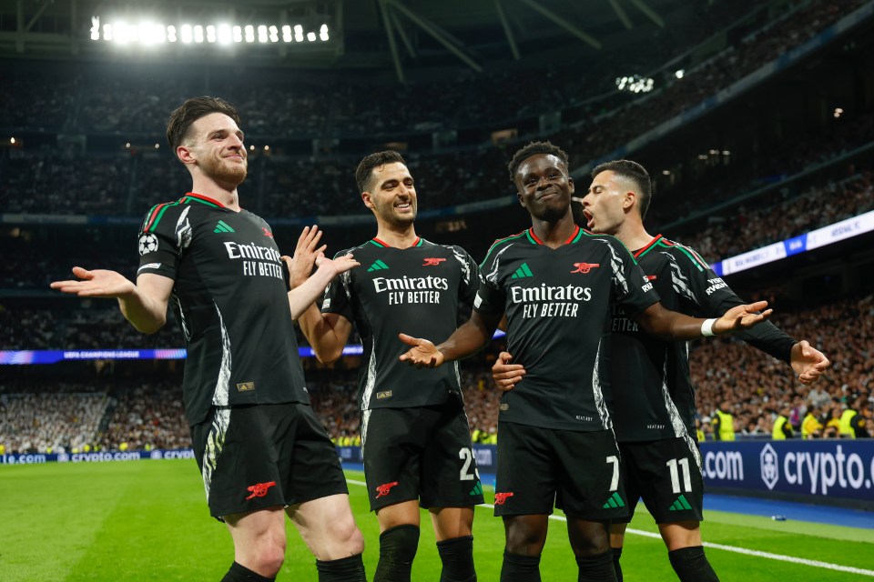 Arsenal players celebrating a goal.
