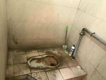 Dirty toilet in a Chinese factory.