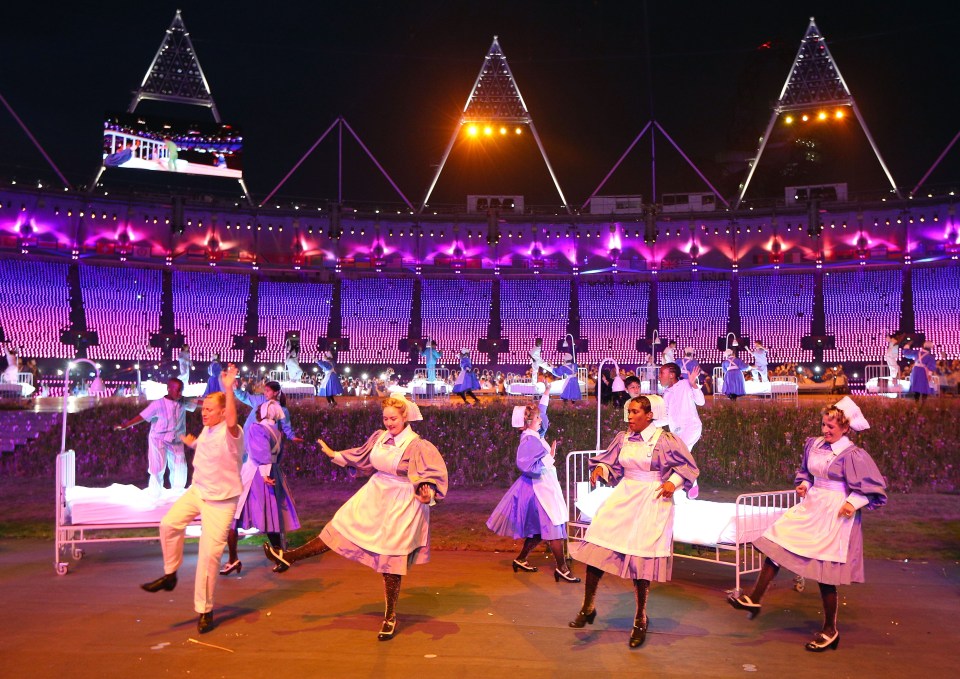 Children and nurses in period costume performing at the 2012 London Olympic Games opening ceremony.