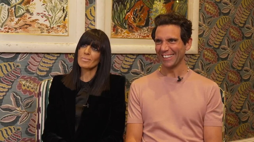 Claudia Winkleman and a man sitting for an interview.