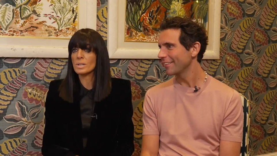 Claudia Winkleman and a man in an interview.