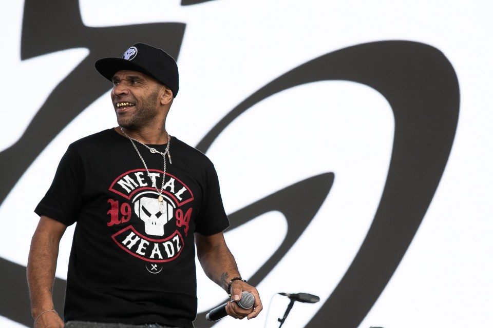Goldie performing at a music festival.