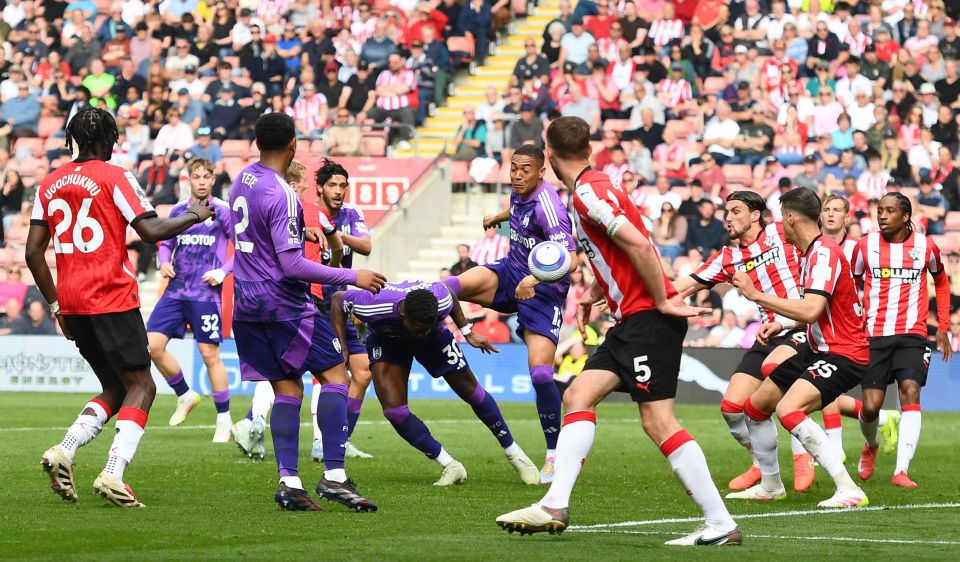 Soccer players vying for the ball during a match.