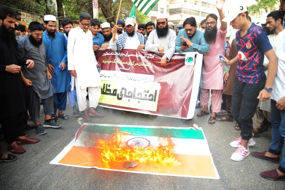Protestors burning an Indian flag in Hyderabad, Pakistan.