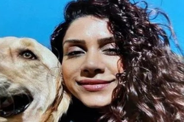Photo of Paria Veisi with a dog.