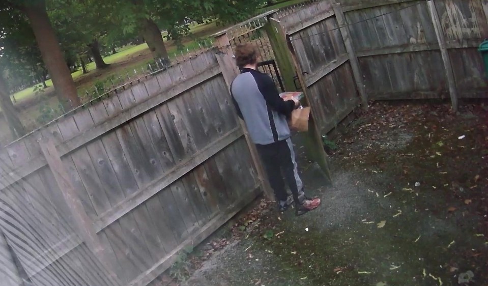 CCTV footage of a man collecting a pizza delivery; his shoes are bloodstained.