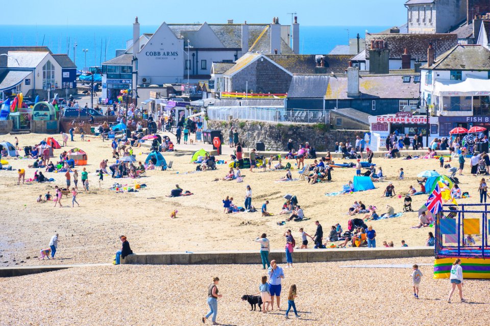Crowded beach in Lyme Regis, Dorset, UK.
