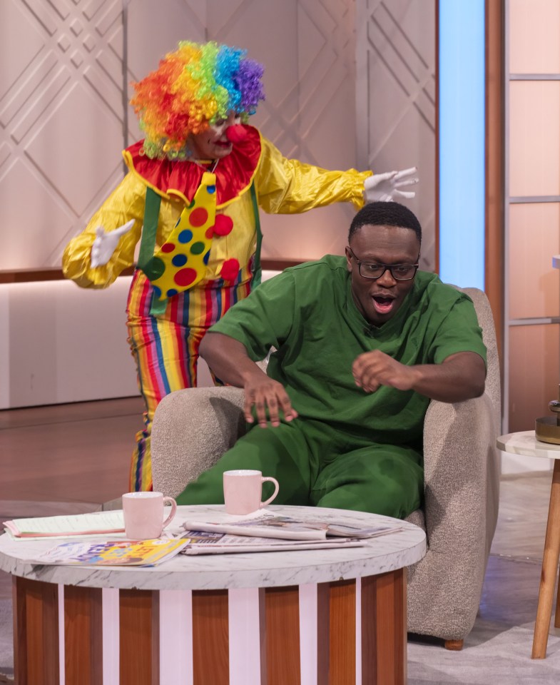 Deji Olatunji surprised by a clown on the Lorraine TV show.