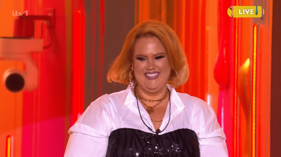Smiling woman on a game show.
