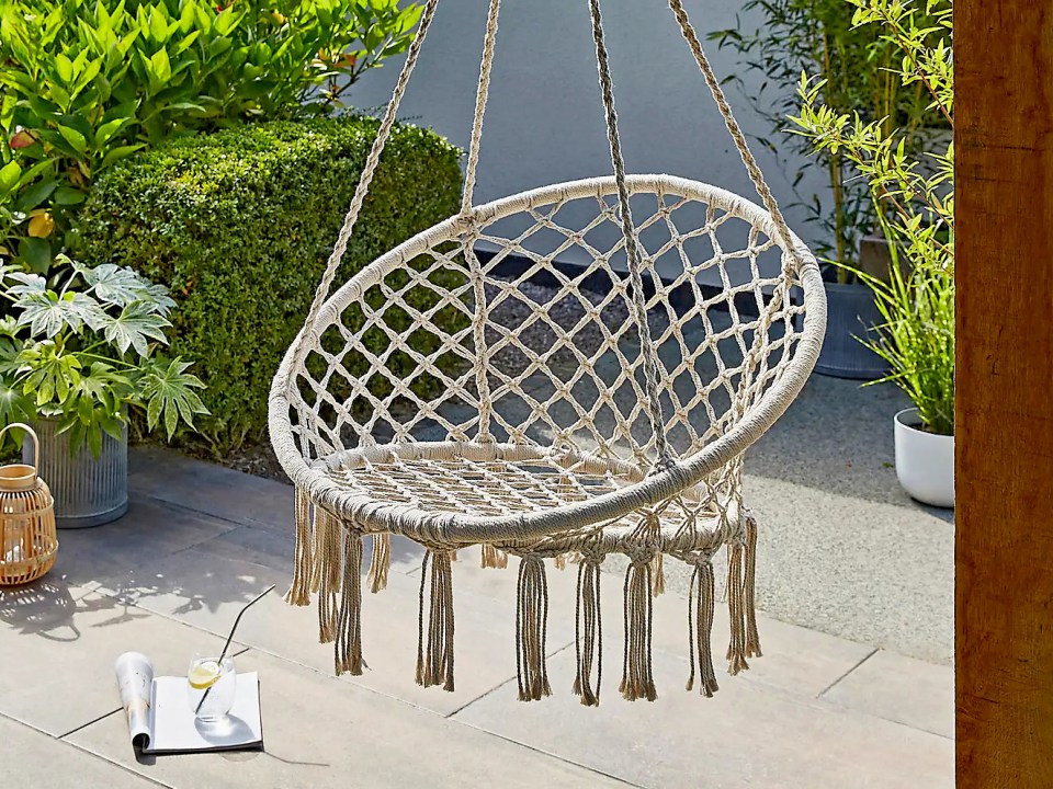 Macrame garden swing chair with tassels.
