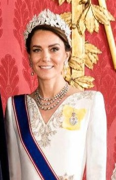 Formal portrait of the British Royal Family at Buckingham Palace.