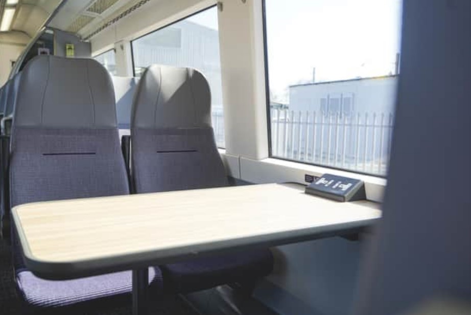 East Midlands Railway train seating with fold-down table.