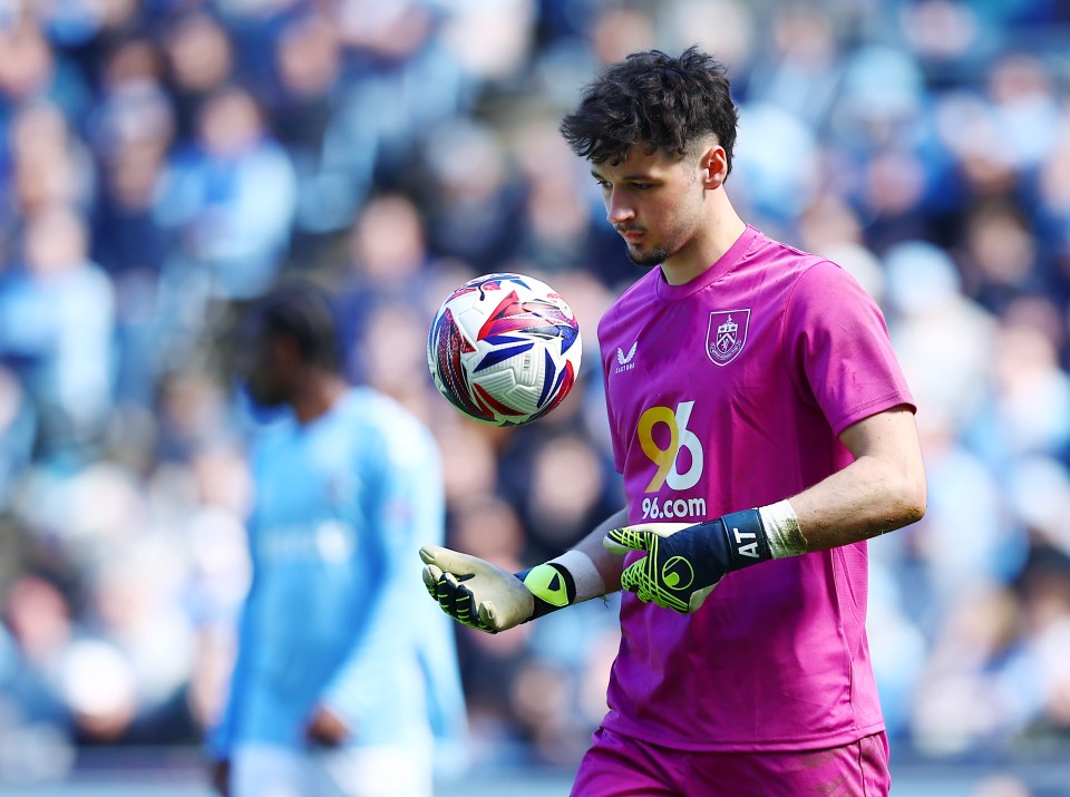 Burnley goalkeeper James Trafford juggling a soccer ball.