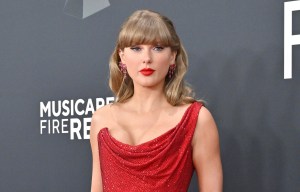 Taylor Swift at the Grammy Awards in a red dress.