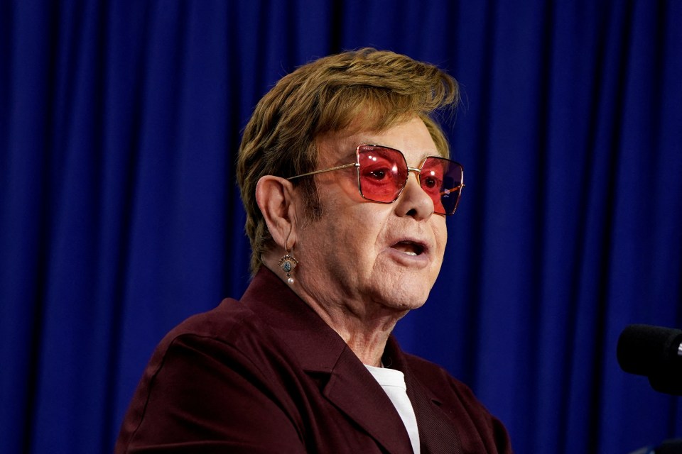 Elton John speaking at an event.