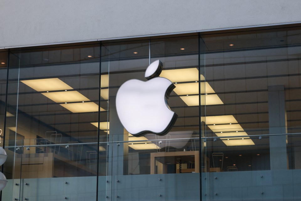 Apple logo on the exterior of an Apple store.