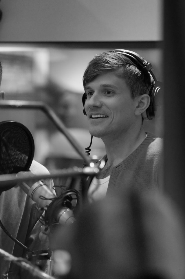 Black and white photo of Fleur East and Will Best in a recording studio.