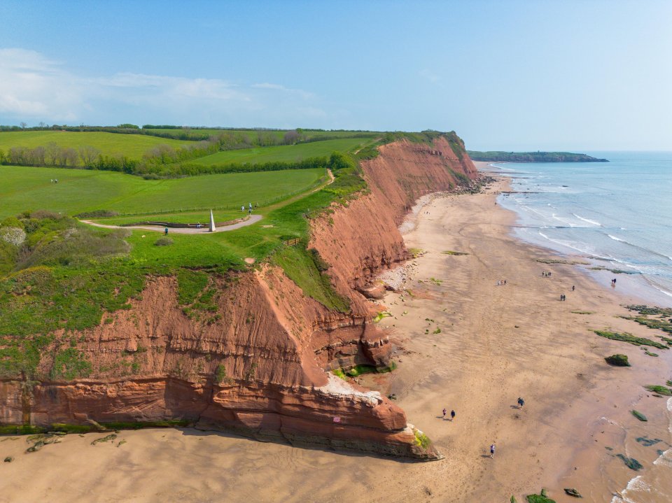 Aerial view of red cliffs and beach in Exmouth, Devon.