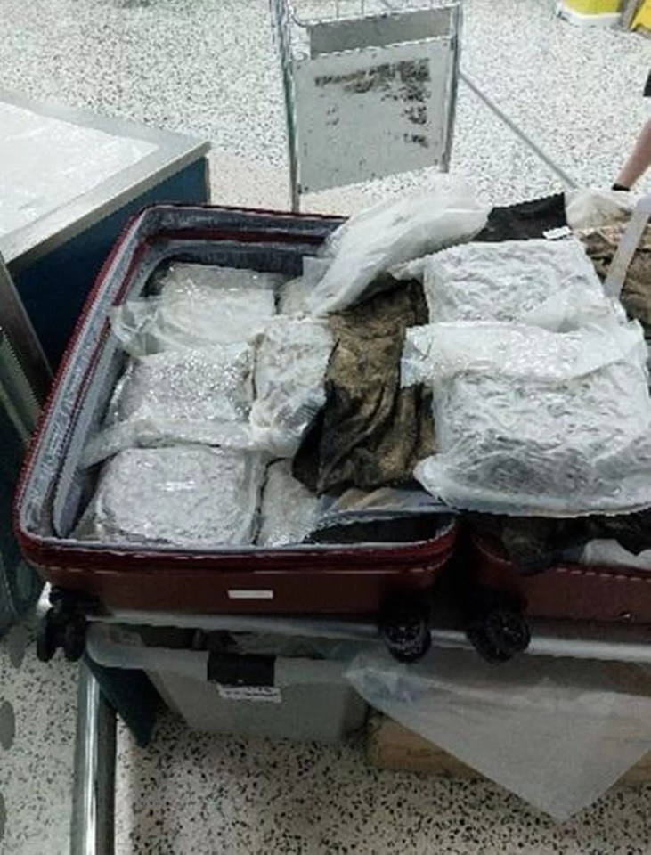 Suitcases full of drugs seized at an airport.