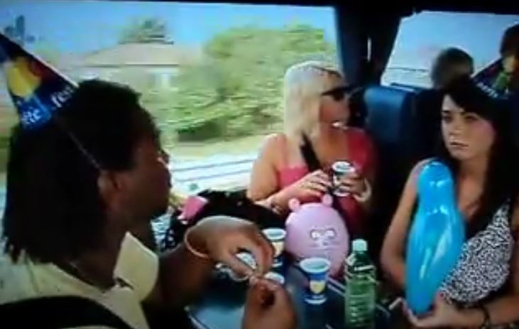 Screenshot of people on a bus.