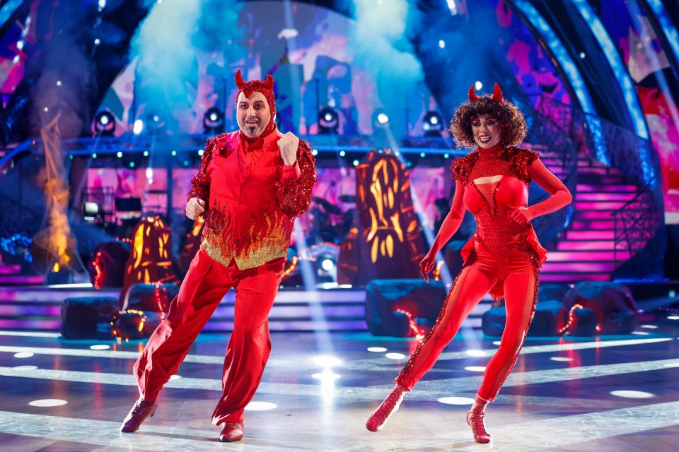 Katya Jones and Wynne Evans in devil costumes dancing on Strictly Come Dancing.