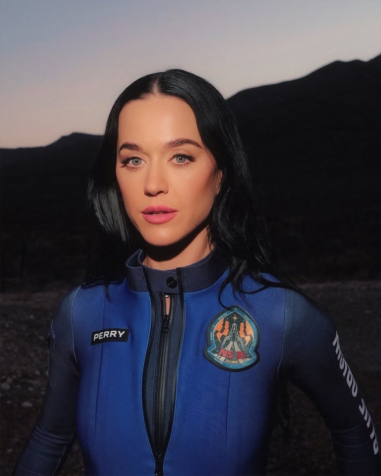 Katy Perry in a blue space suit.