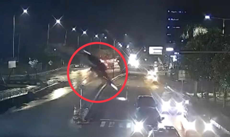 CCTV footage of a car falling from an unfinished bridge at night.