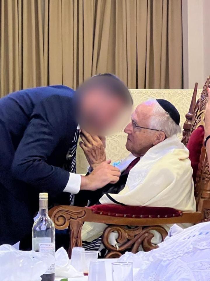 IDF reservist Captain U with his grandfather, a Holocaust survivor.