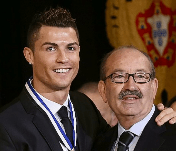 Cristiano Ronaldo with an older man.