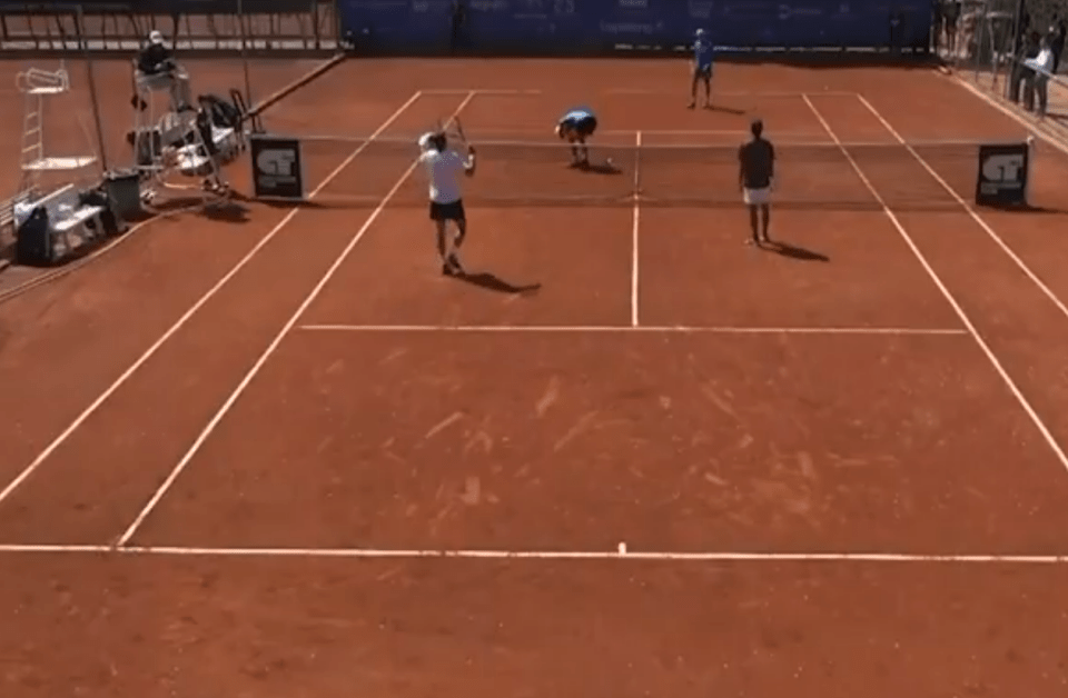 Tennis players on a clay court.