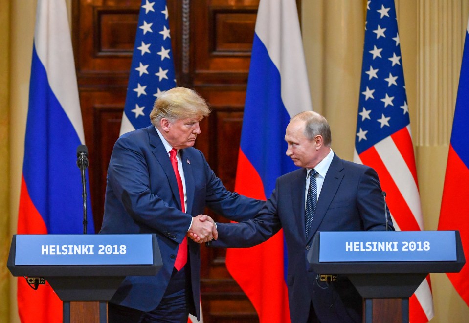 Trump and Putin shaking hands in Helsinki.