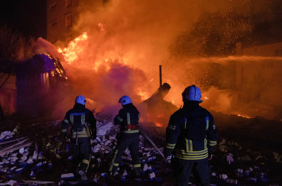 Firefighters battling a large building fire.