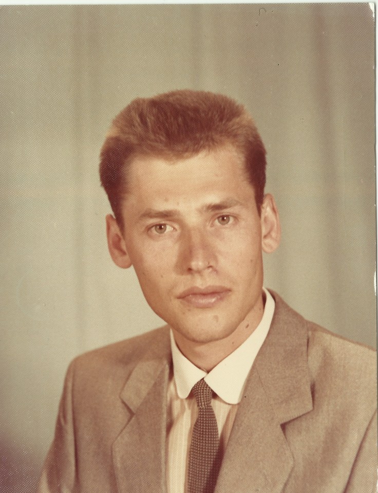 Portrait of a young man in a suit.