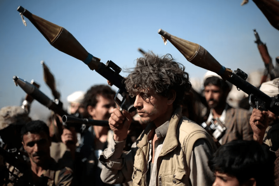 A group of men with rocket launchers.
