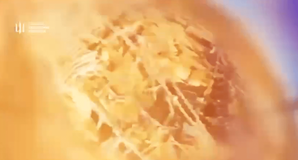 Abstract illustration of a golden, textured mass.