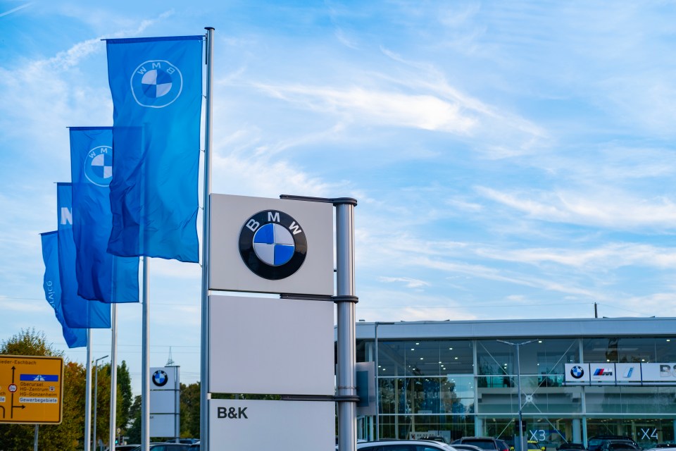 BMW dealership signage with flags.