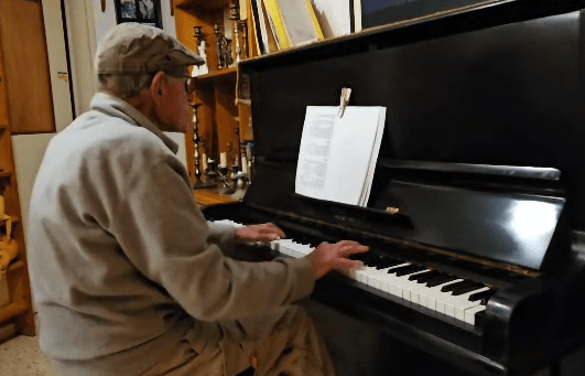 Man playing piano.