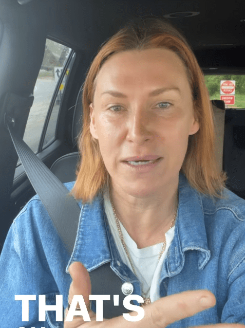 Woman in a denim jacket speaking in a car.