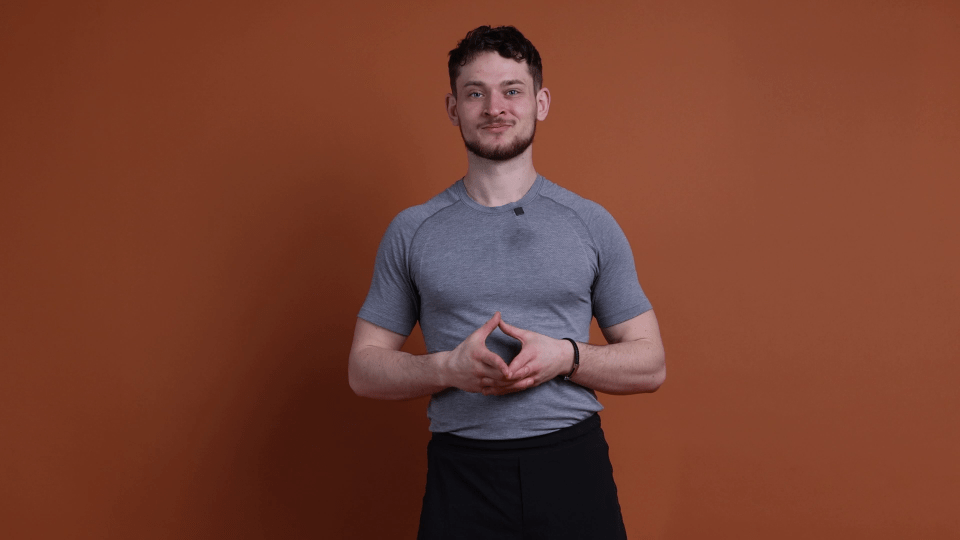 Man in gray shirt demonstrating exercises.