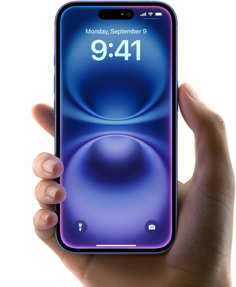 Hand holding iPhone with lock screen showing time.